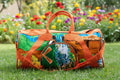 Sac de voyage polochon artisanal en toile de jute et pagne africain