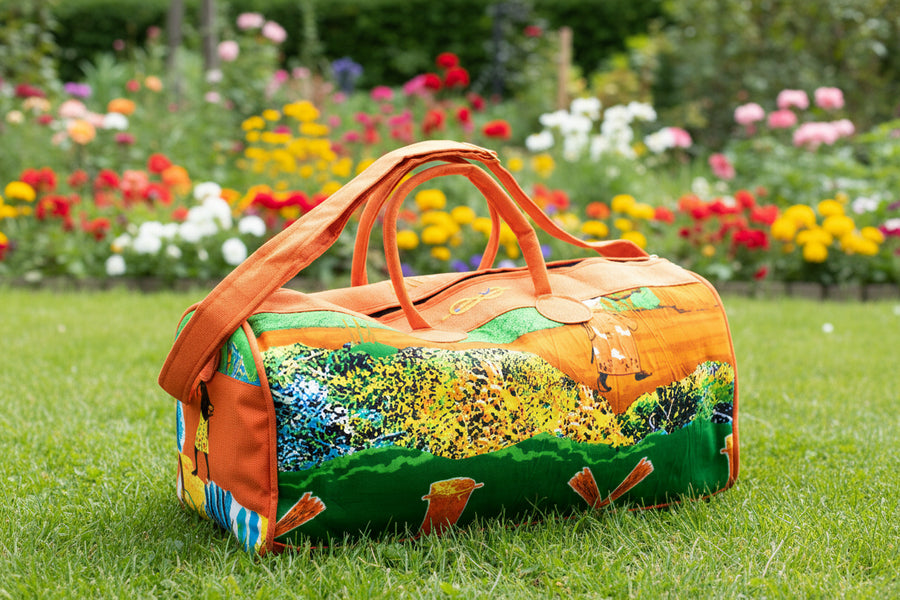 Sac de voyage polochon artisanal en toile de jute et pagne africain