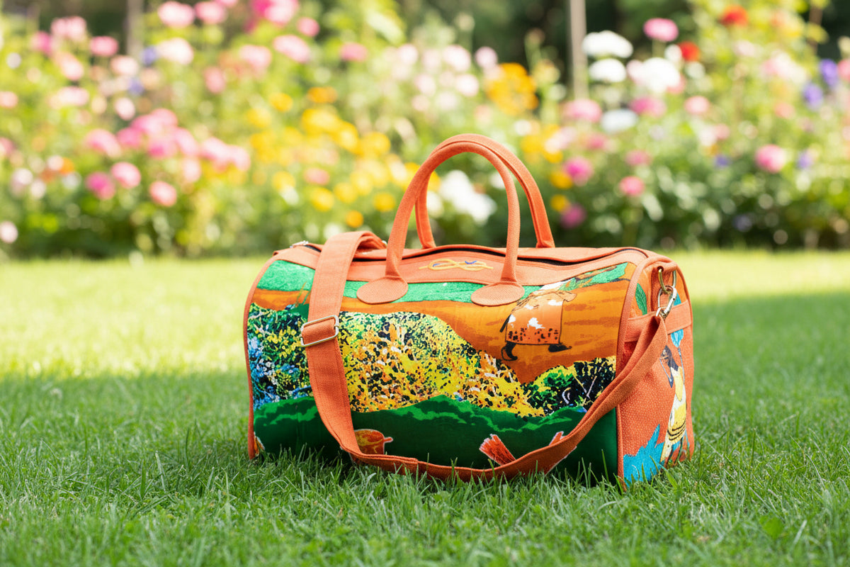 Sac de voyage polochon artisanal en toile de jute et pagne africain