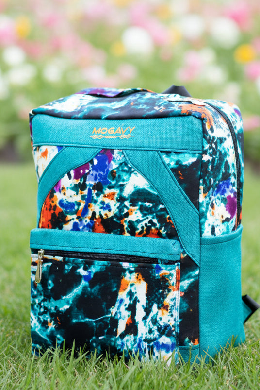 Sac à dos artisanal en toile de jute turquoise et motifs abstraits multi-couleurs