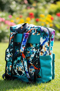 Sac à dos artisanal en toile de jute turquoise et motifs abstraits multi-couleurs
