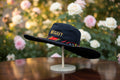 Chapeau Capeline noir intemporel & bordure pagne camerounais rouge et jaune